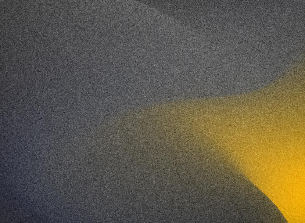 Abstract gradient background with dark gray and yellow colors blending.