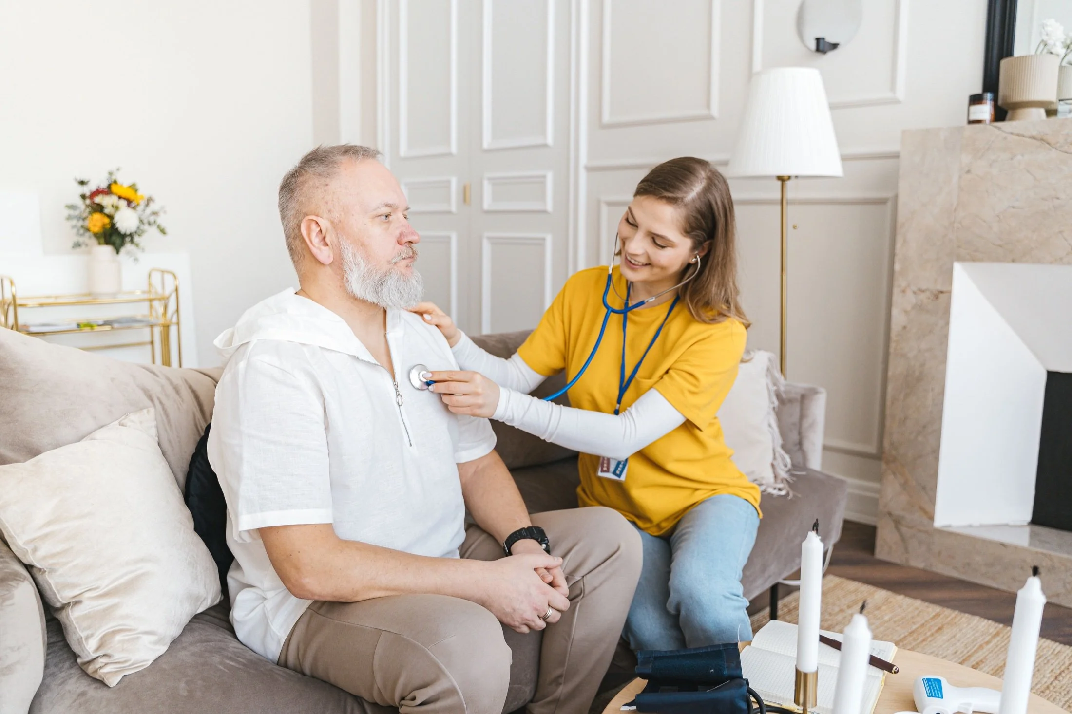 F&P care professional checking a man’s chest with a stethoscope