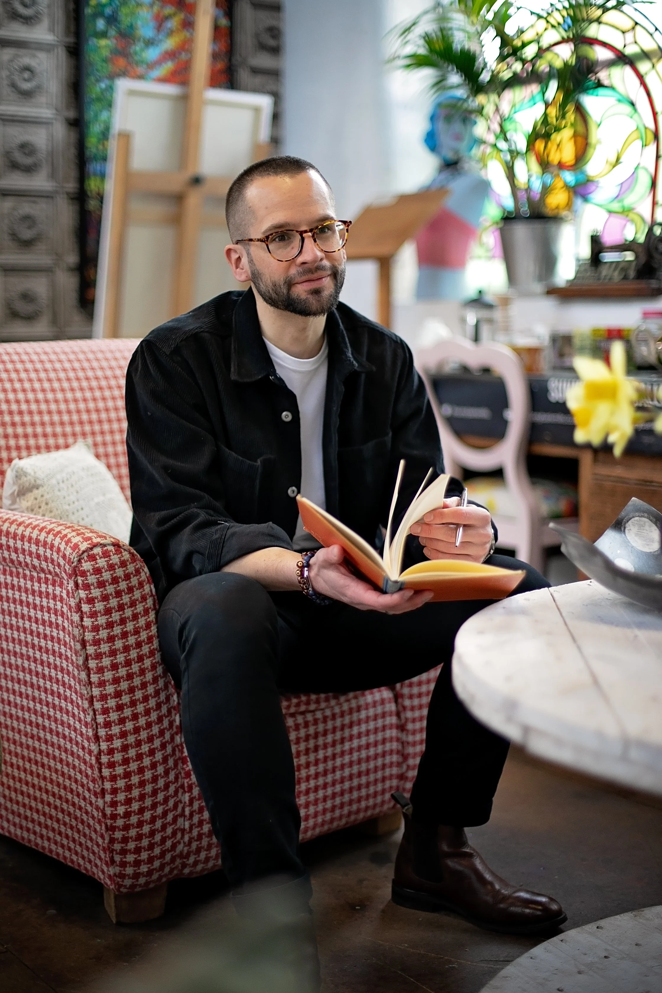 Man sitting with a notepad in his hands