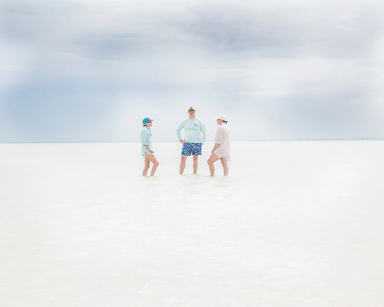 On-Location Luxury Resort Lifestyle Photography Capturing an Expansive, High-Key Seascape with Travelers on a Sandbar