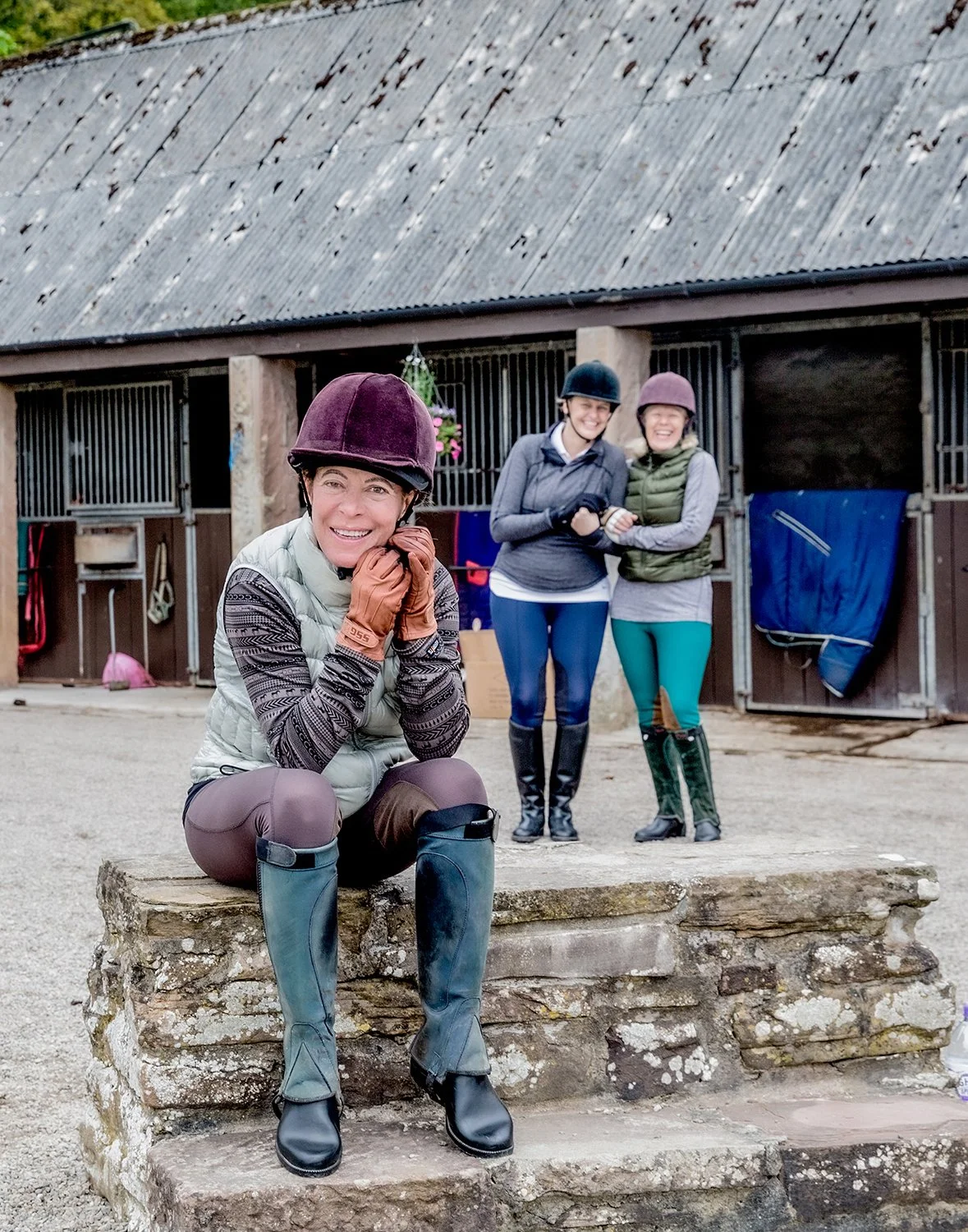 Portrait 3 Women Wearing Riding Gear in Front of Horse Stables