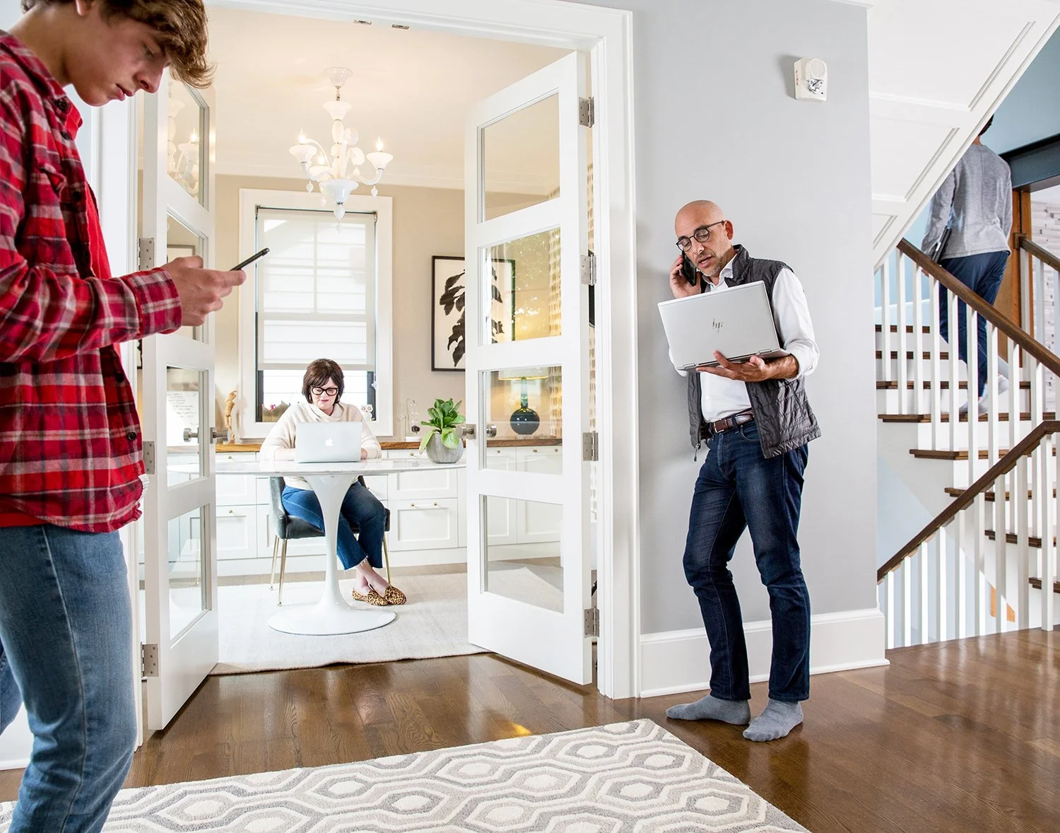 On-Location Lifestyle Photography of People Working from Home and Using Digital Devices in a Modern House