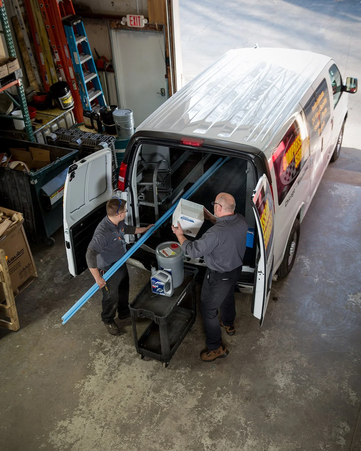 Chicago Industrial Photography of Two Men Loading a Truck in a Warehouse Facility