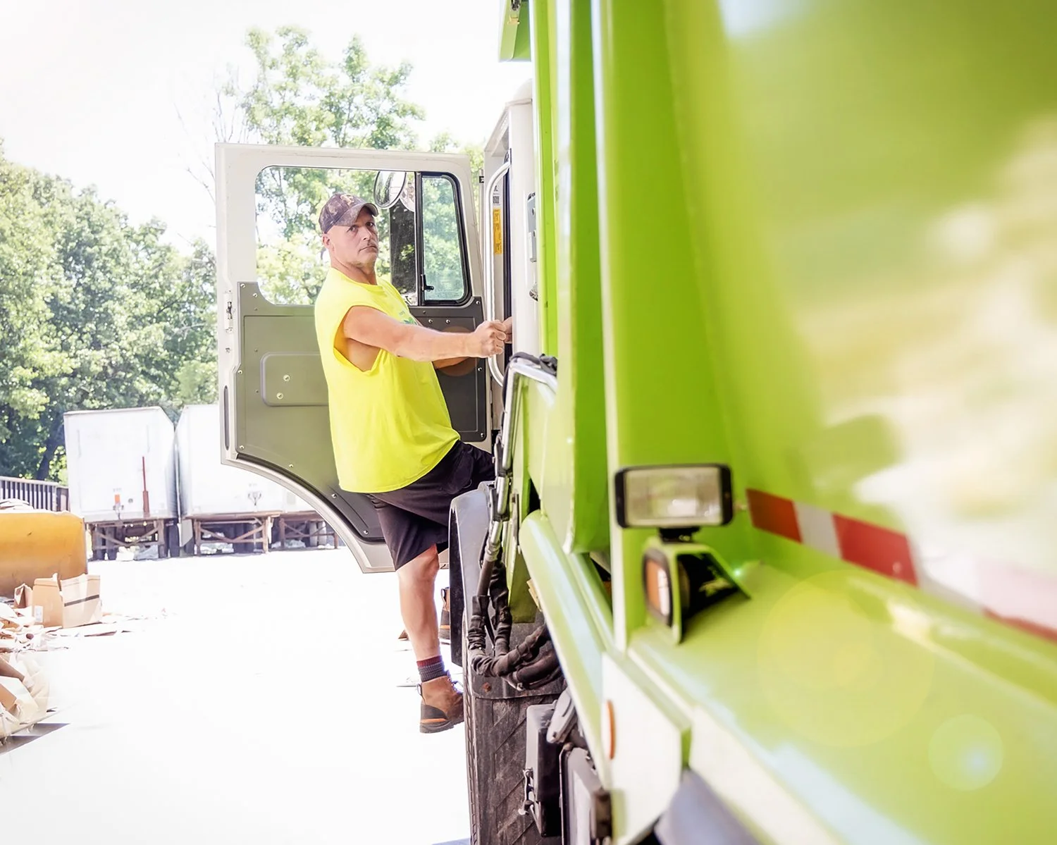 Portrait of Truck Driver Climbing into his Truck