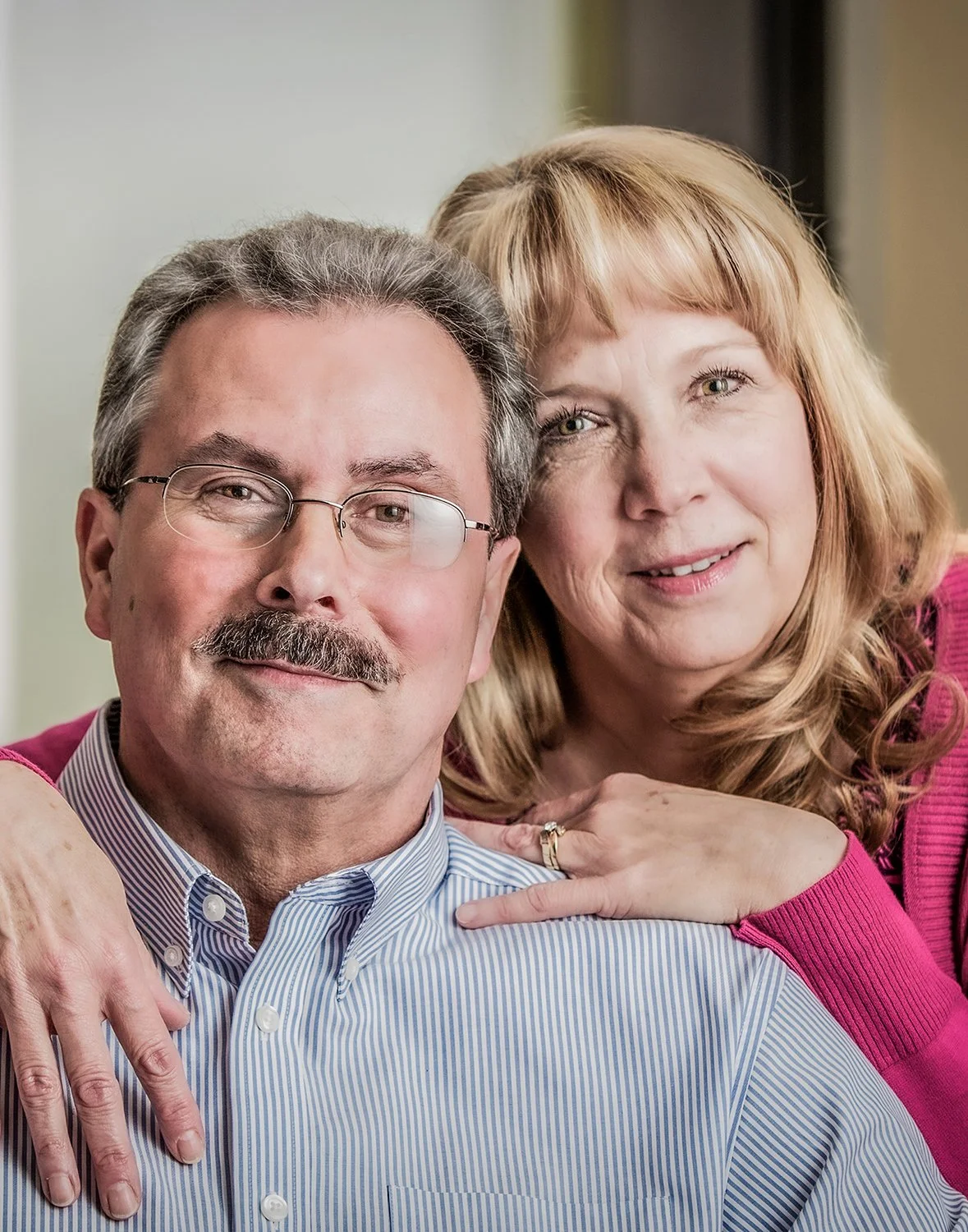 Professional Lifestyle Portrait of a Mid-50's Couple Smiling Together for Healthcare Marketing Purposes