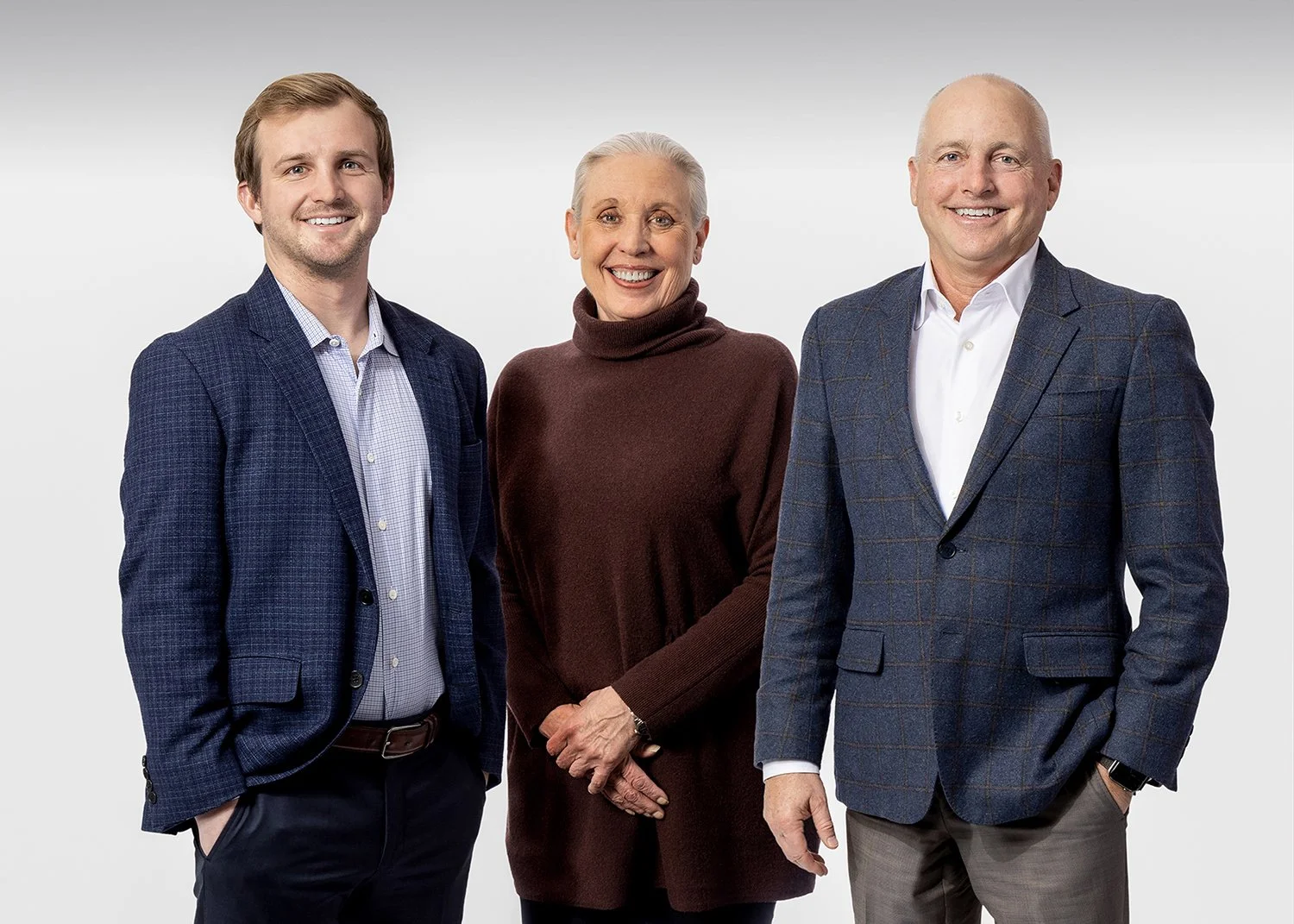 Corporate Team Headshot of 3 RW Baird Financial Executives shot against White Background