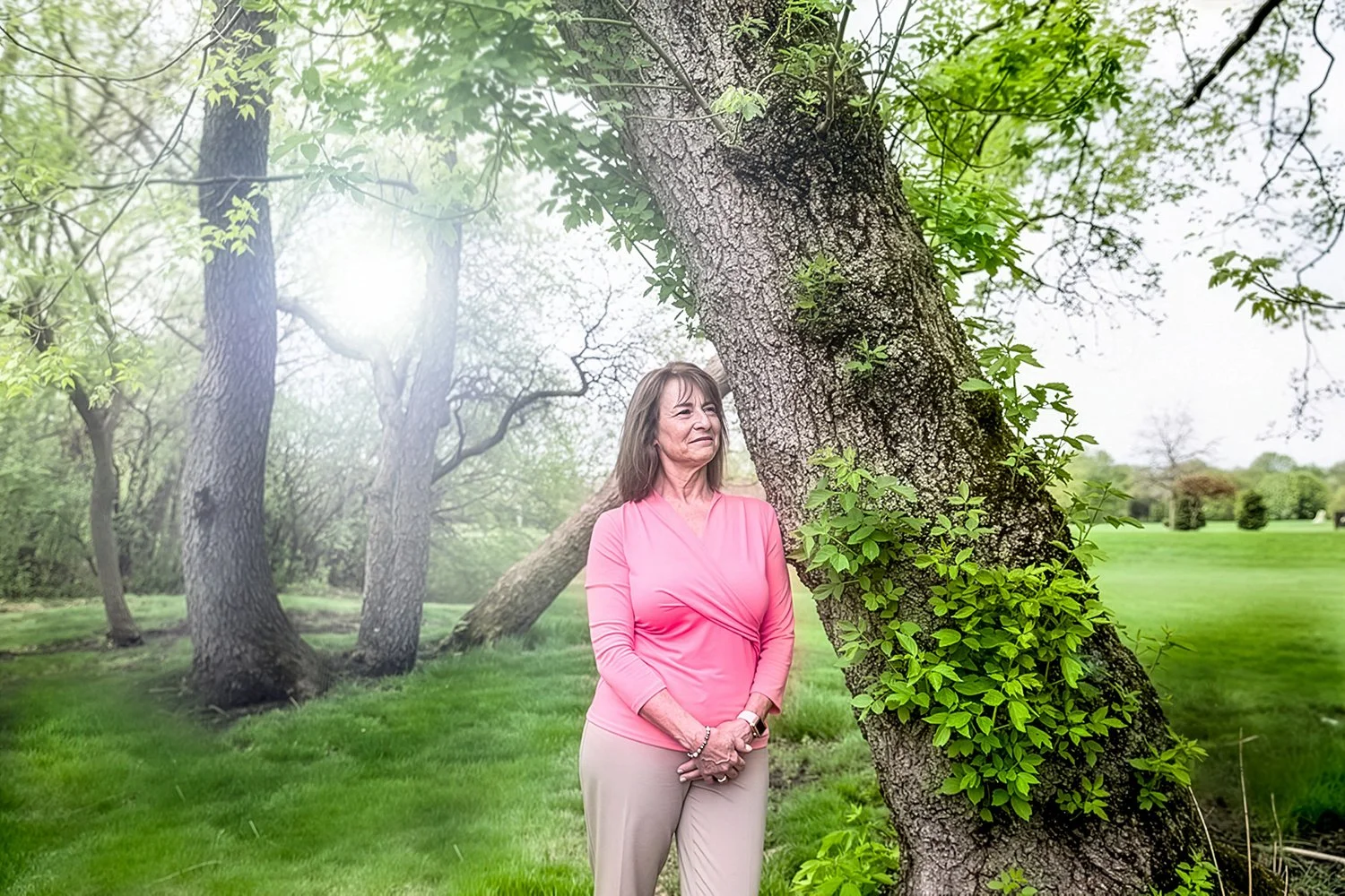 Chicago Corporate Portrait Photography of Female Outdoors Leaning against a Tree for Healthcare Marketing Purposes