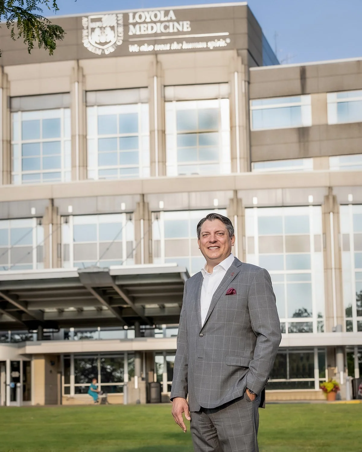 Commercial Corporate Portrait Photography of a Business Executive in a Tailored Suit, shot by an Advertising Photographer Outside a Modern Corporate Campus