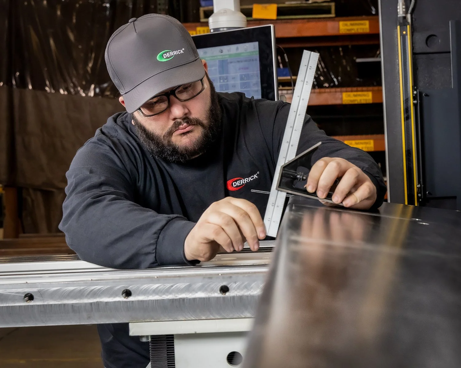 Man doing Careful Calibrations in an Industrial Manufacturing Facility
