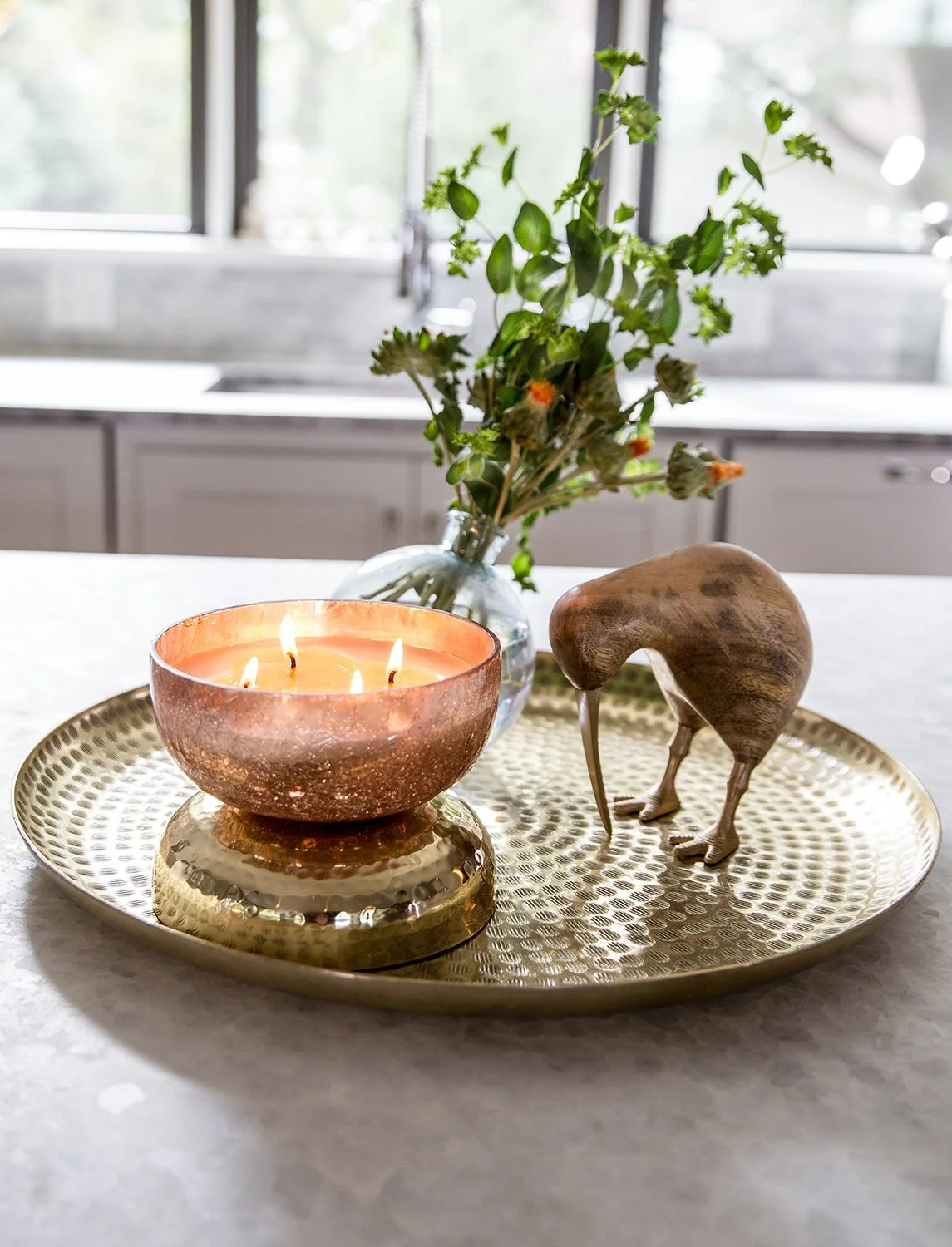 Close-up Interior Detail Photography of a Styled Countertop Vignette with a Blurred Kitchen Background