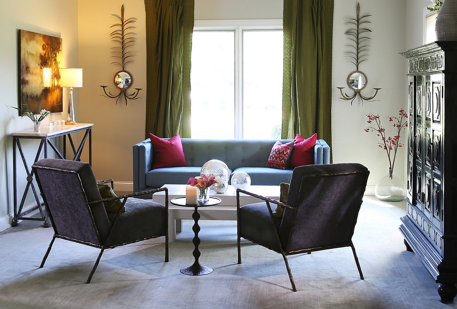 Earthy Living Room Interior Featuring Olive Green Curtains, a Blue Sofa, and Two Dark Velvet Armchairs