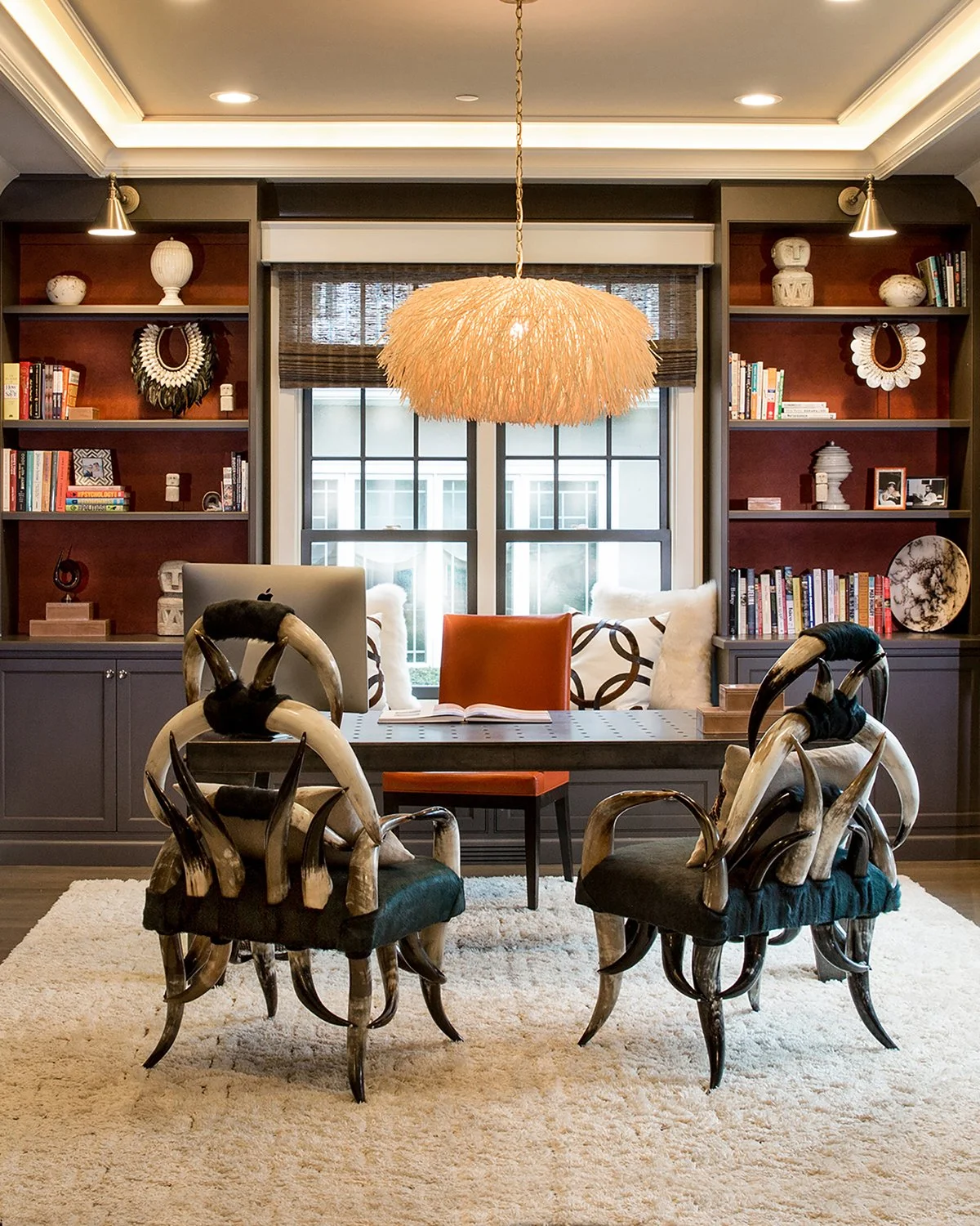 Chicago Interior Photography of a Styled Home Office with a Textured Fiber Pendant Light, Custom Built-Ins, and two Decorative Horn Armchairs