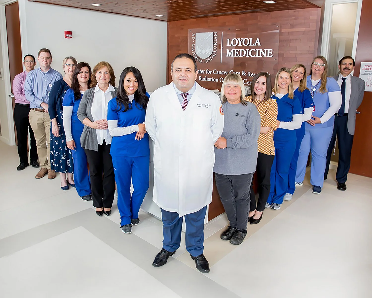 Portrait of Head Surgeon, Nurses and Support Staff in Medical Lobby