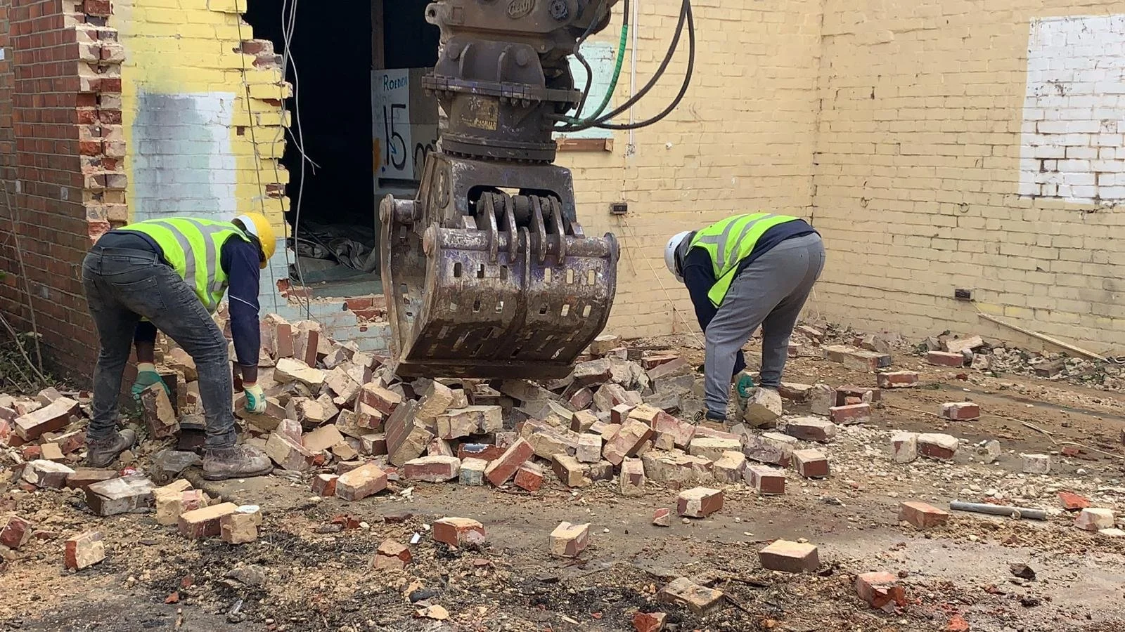workers-sorting-salvaged-bricks-reading-projec.jpg