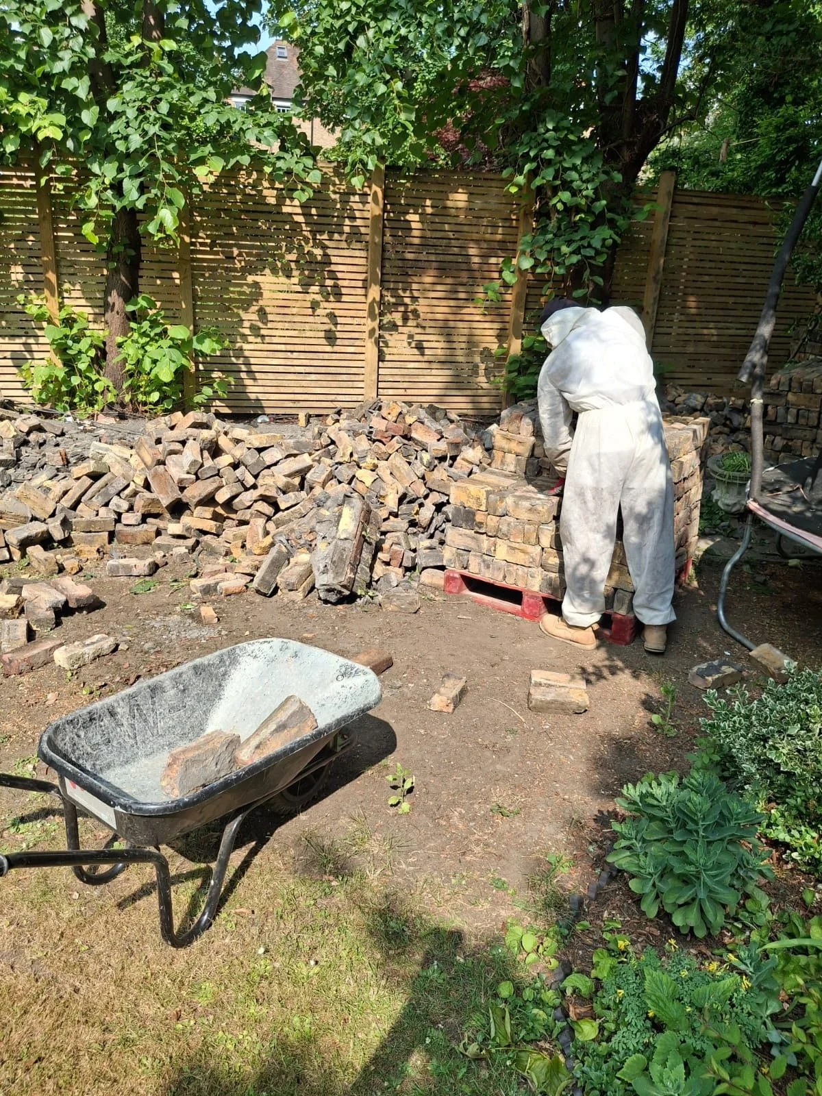 cleaning-and-sorting-salvaged-bricks-on-site.JPG