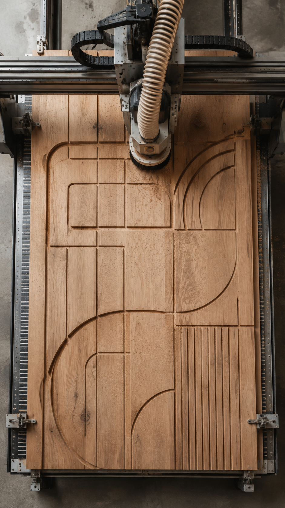 A CNC machine carving geometric patterns into a wooden surface.