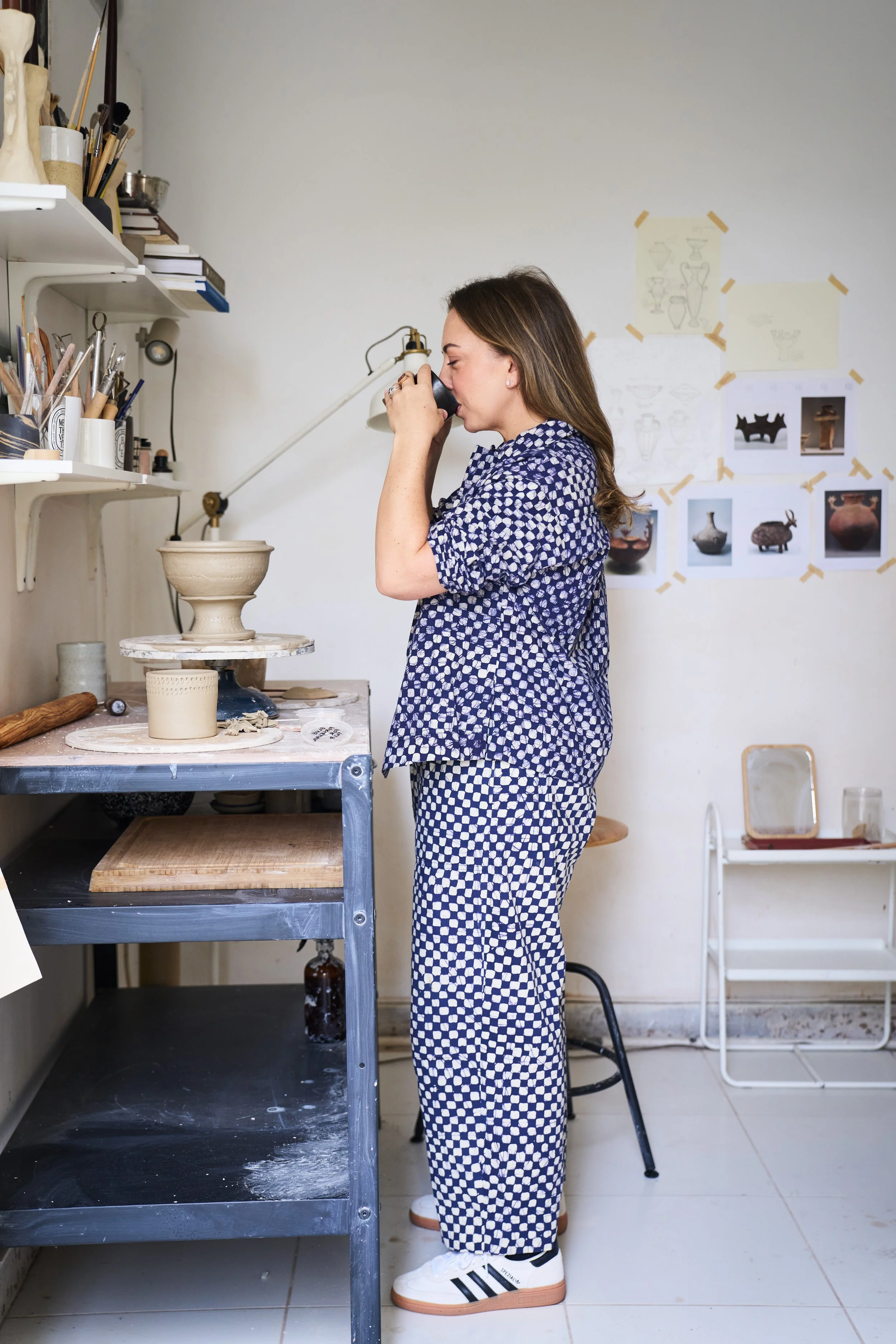 A portrait of Britt Singleton, founder of Casa Adega Studio, standing in the pottery studio space of the brand, based in Jumeirah, Dubai