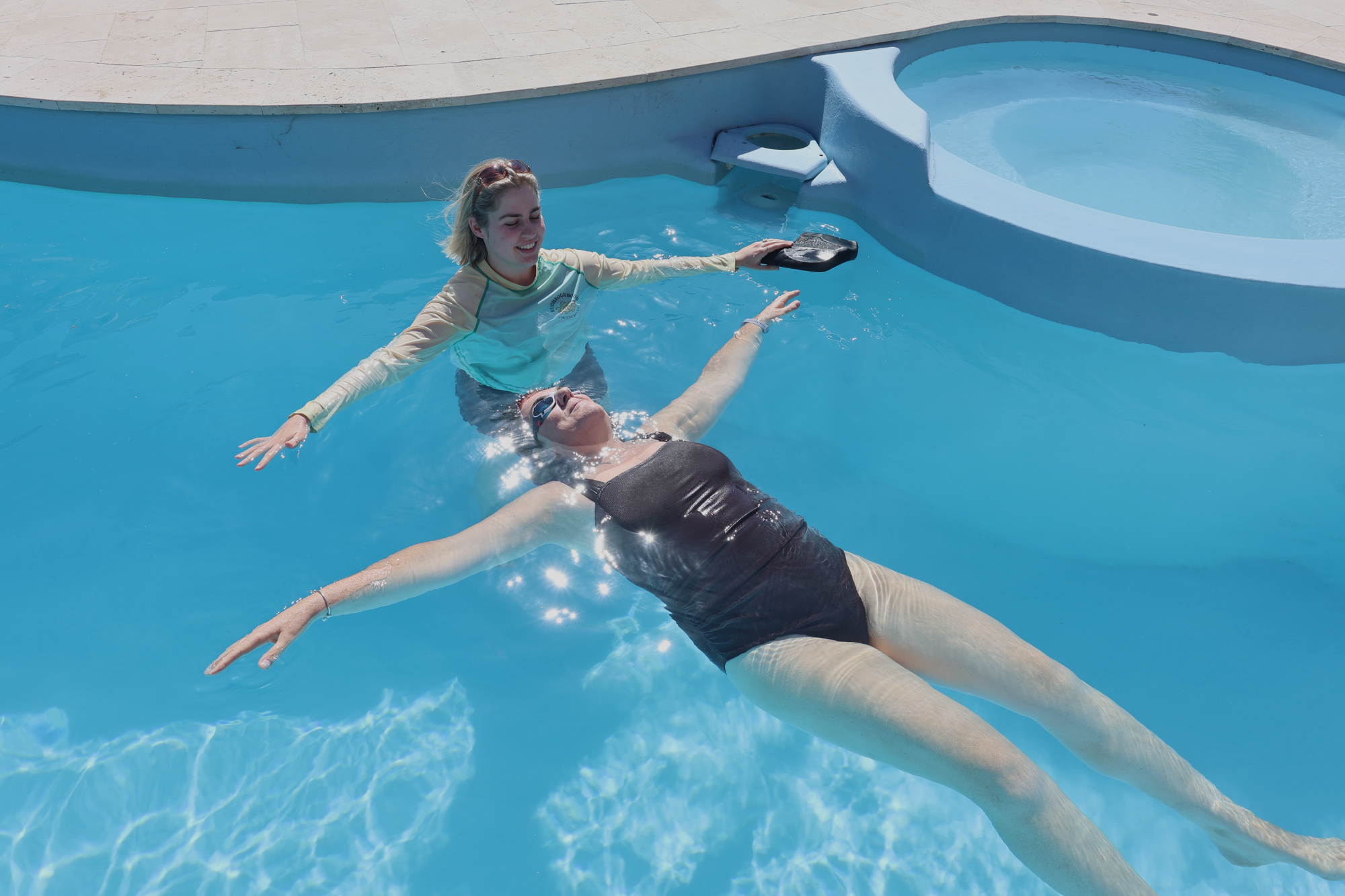 woman-floating-on-her-back-in-the-pool