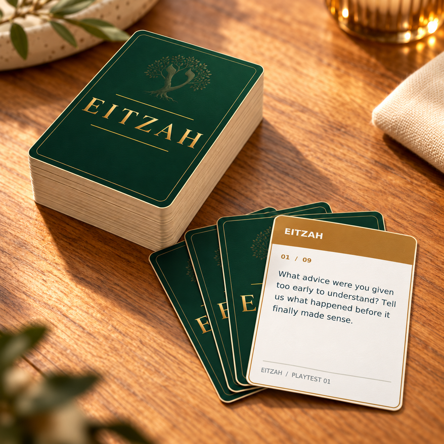 Eitzah wisdom cards showing the green-and-gold backs and a conversation prompt