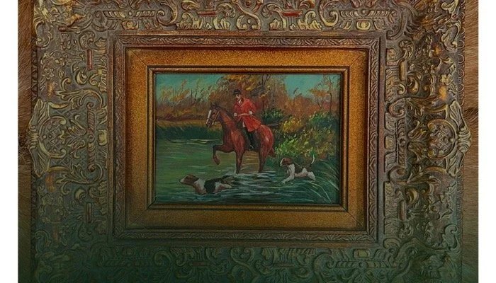 Painting of a person riding a horse through water, with two dogs swimming nearby, surrounded by an ornate frame.