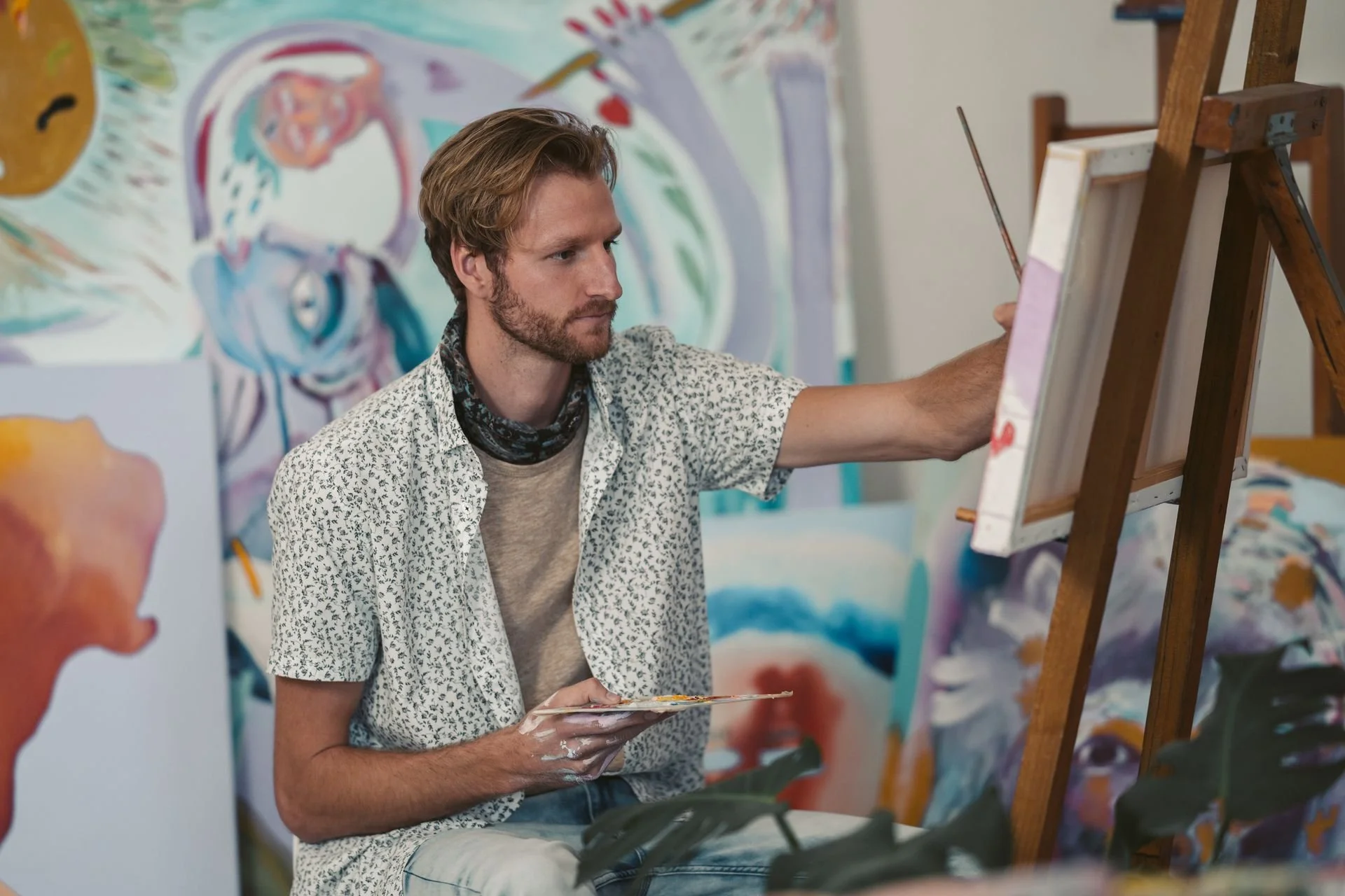 ISFP man being artisti painting in his studio