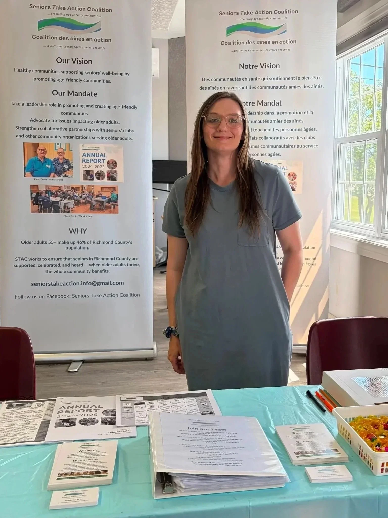 Celeste Gotell at the STAC outreach booth with information banners and handouts