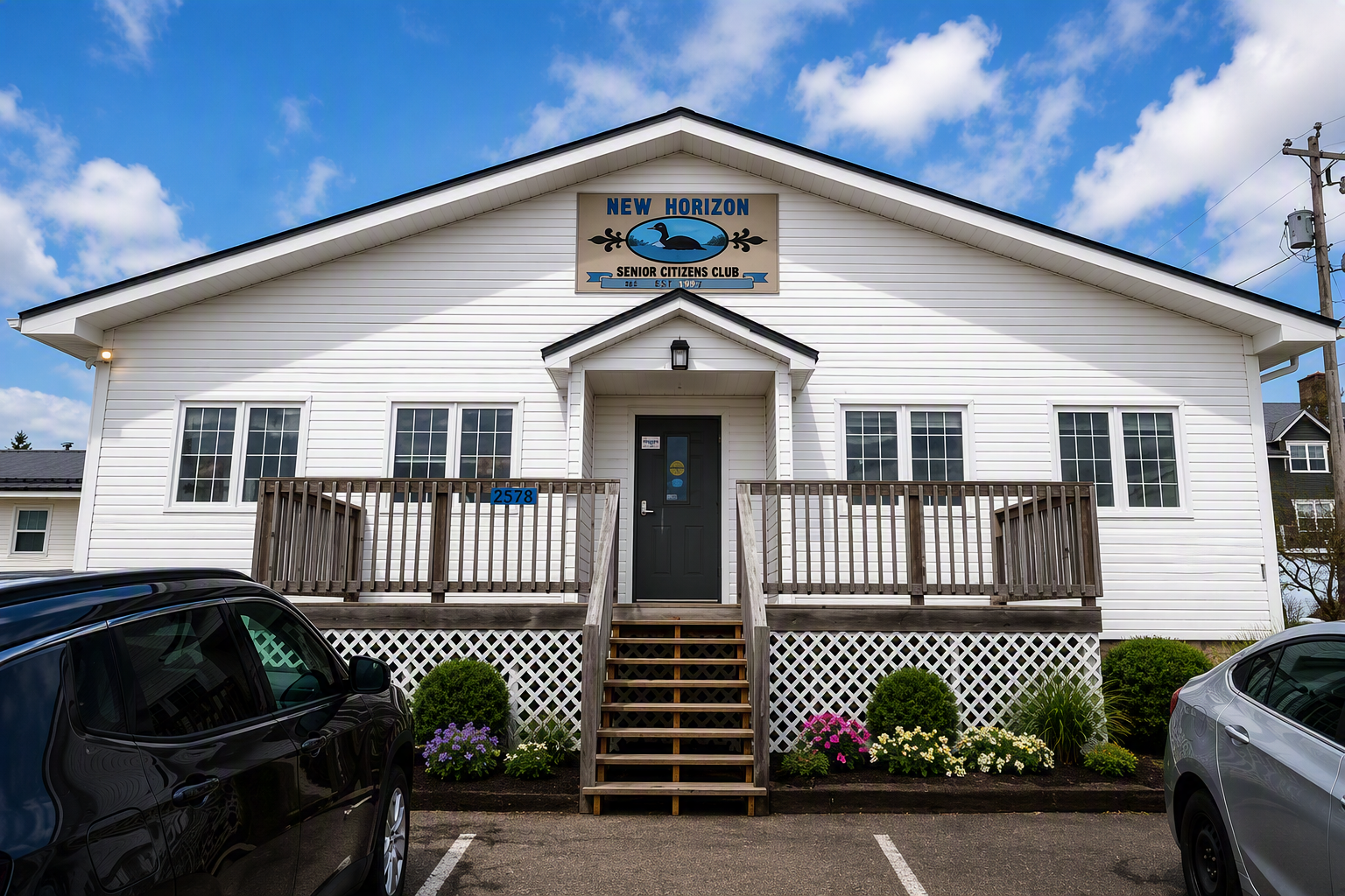 New Horizons Seniors Club building, a white hall with a front deck