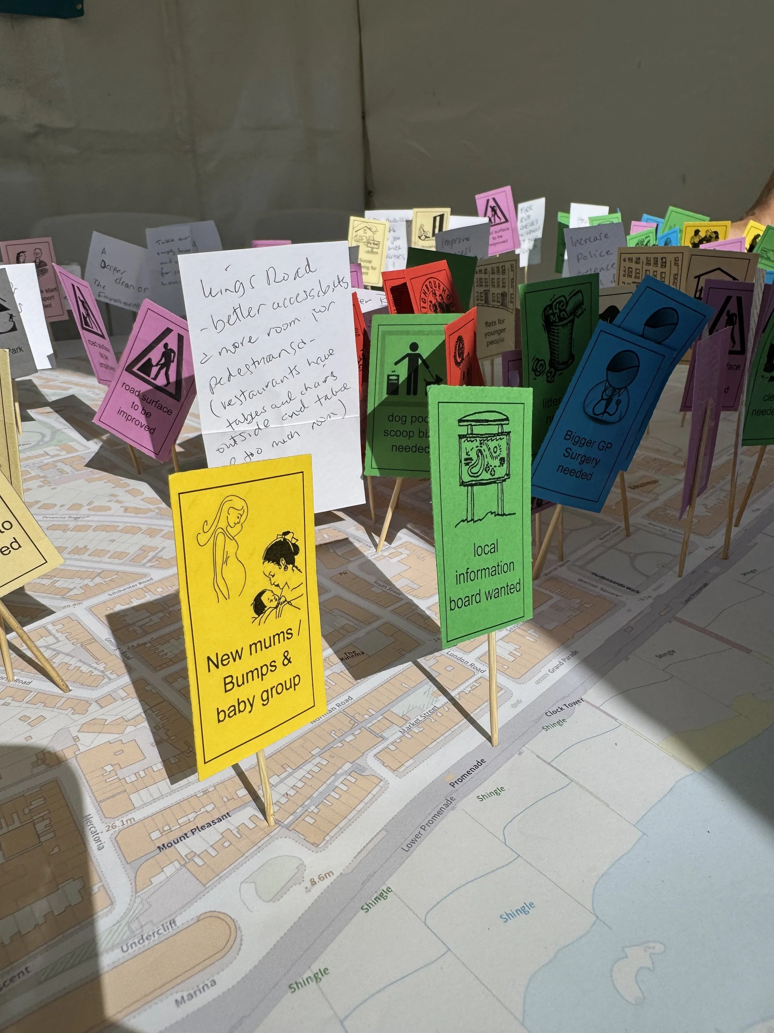 Map of Hastings with ideas written to improve the town written on small pieces of card pinned into the map.