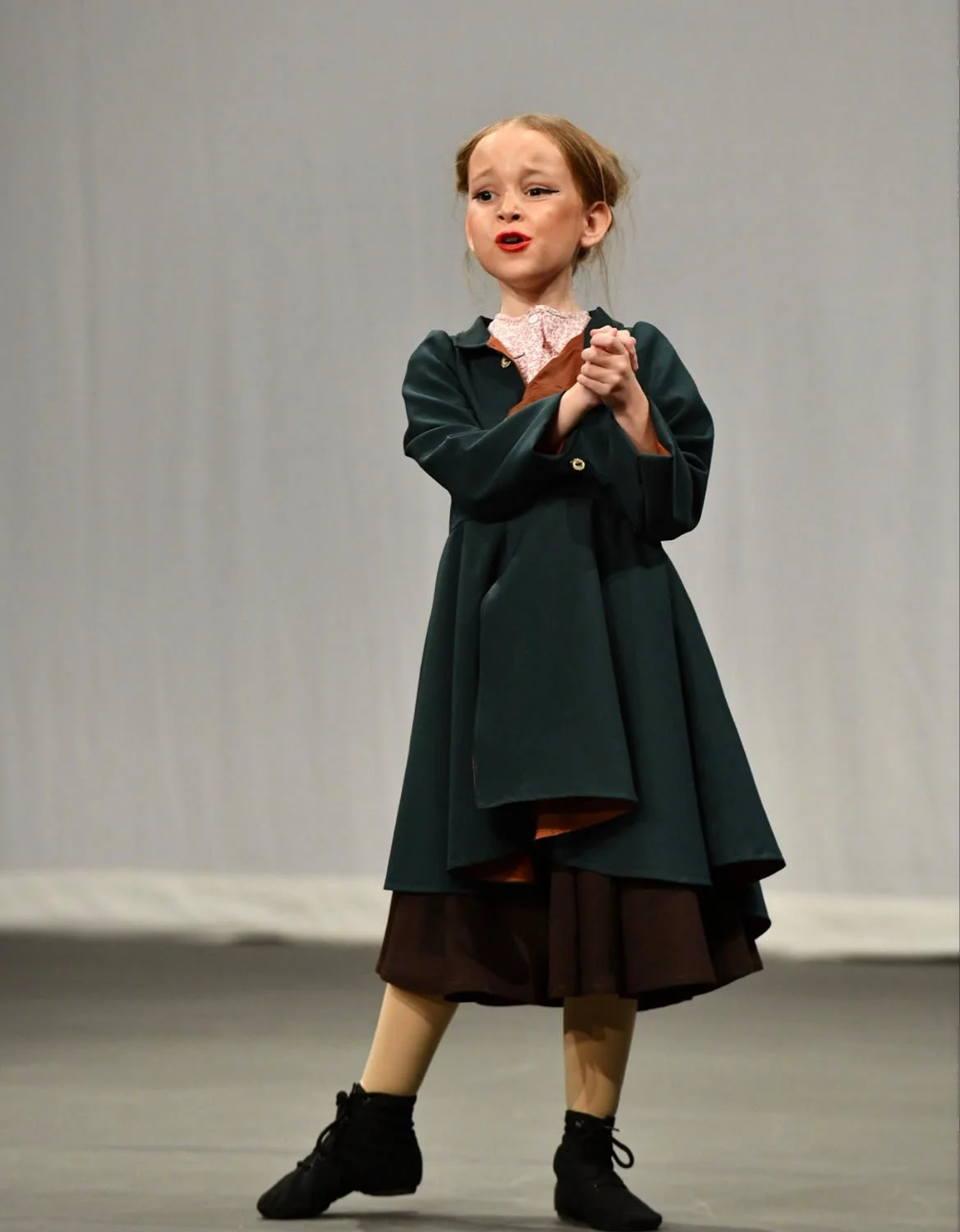 A young girl doing musical theatre solo