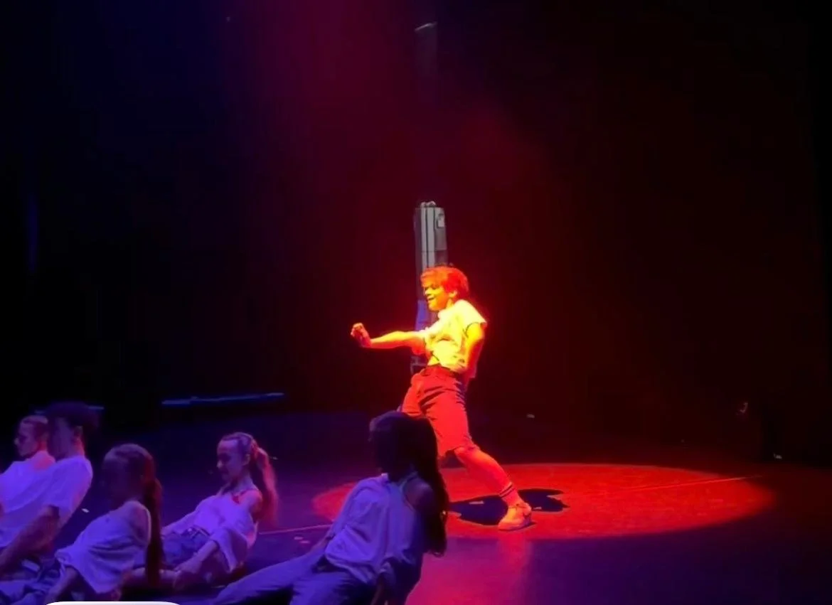 Boy in commercial jazz dance routine