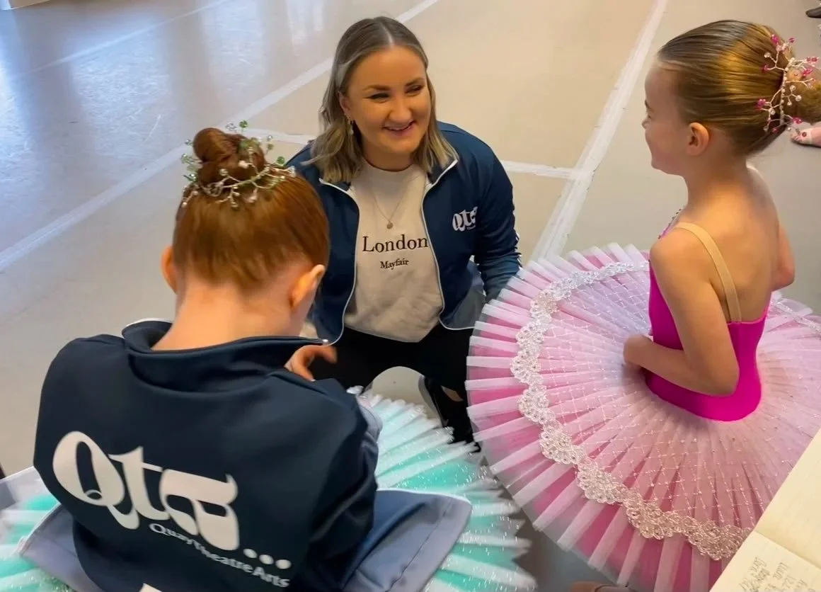 Teacher with two young dancers