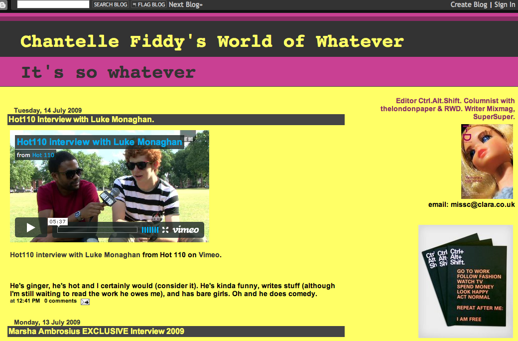 Screenshot of a blog webpage titled "Chantelle Fiddy's World of Whatever" with a yellow and purple background. It features an embedded Vimeo video of an interview with Luke Monaghan, and includes text about him, along with images of a doll and a small booklet.