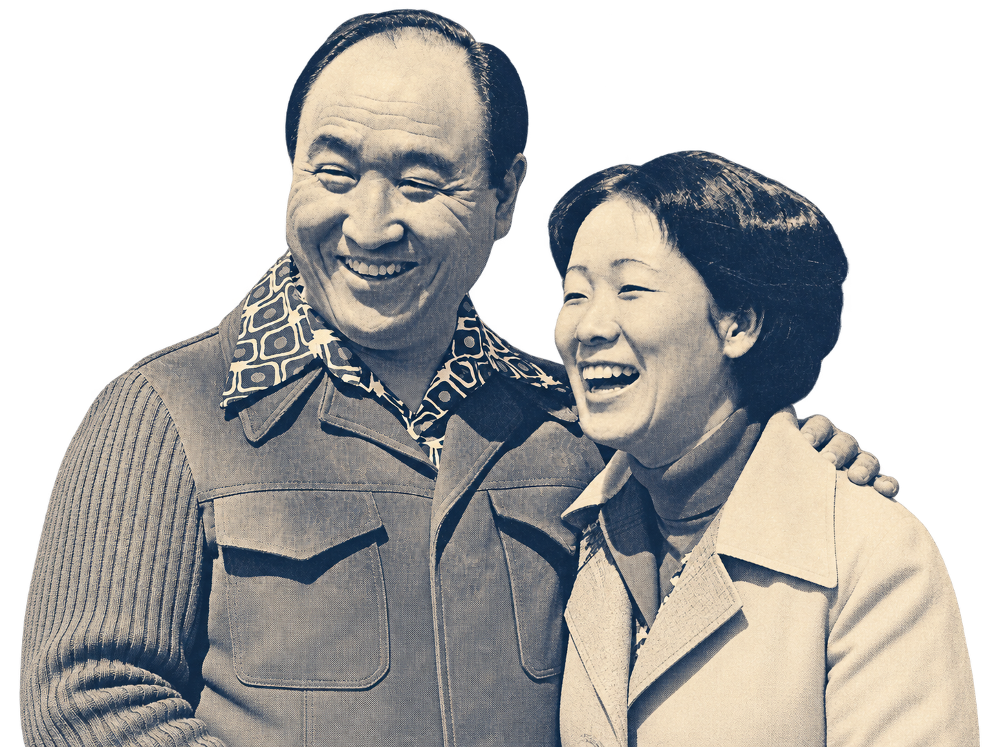 A black and white photo of a man and woman smiling and standing close, with the man's arm around the woman's shoulder.