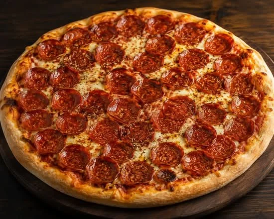 A large pepperoni pizza with melted cheese on a wooden table.