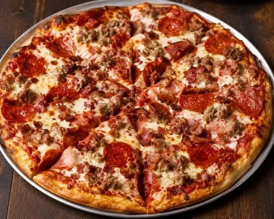 A half-eaten pepperoni and sausage pizza on a round metal tray.