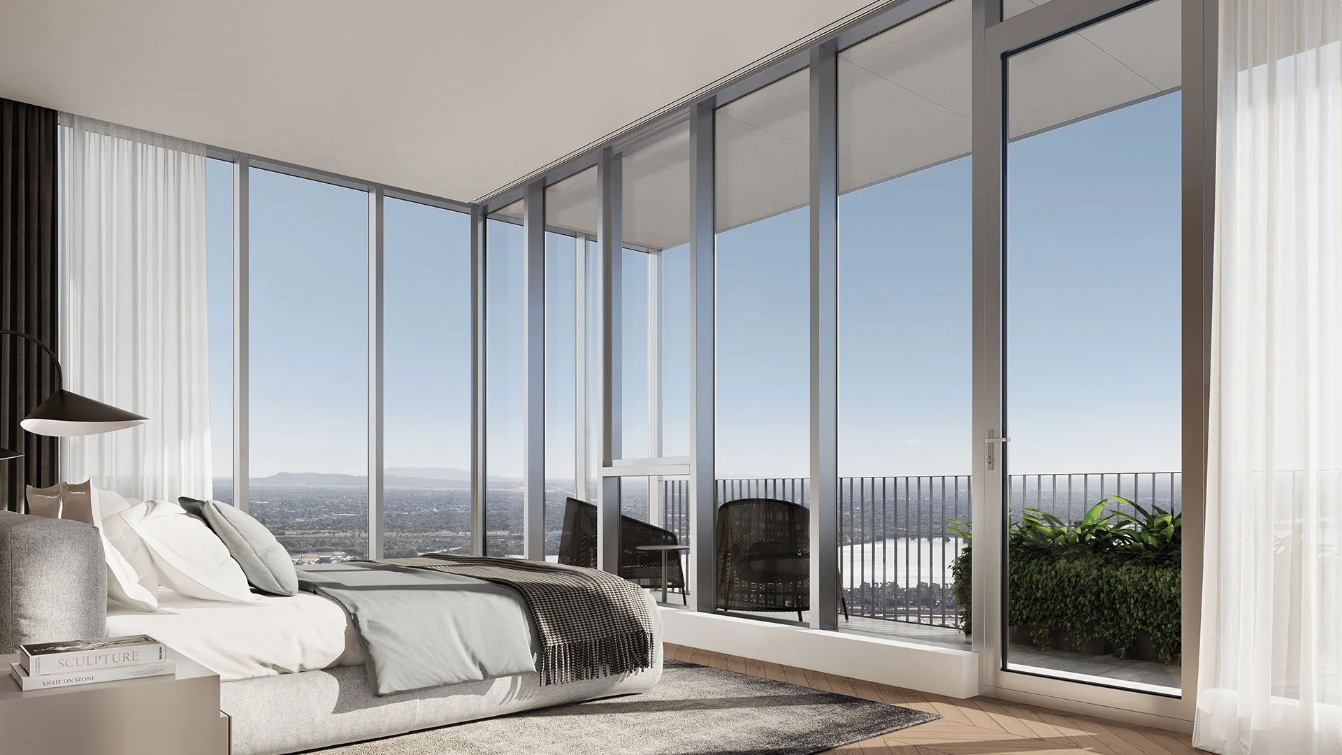 Chambre des maîtres d’un appartement à louer de la Belvedere Collection aux étages supérieurs de Square Phillips, avec vue sur le centre-ville de Montréal