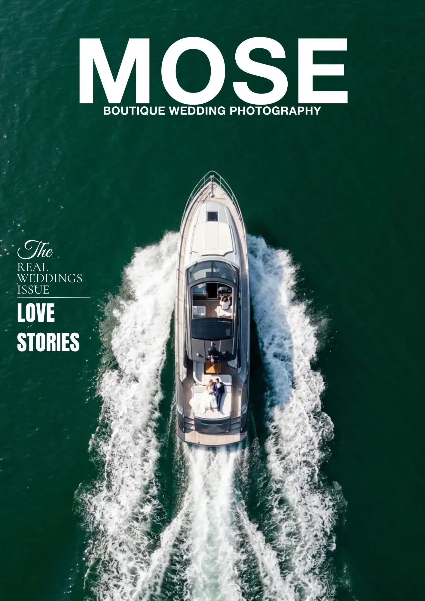 An aerial view of a white yacht cruising on green water, with two people on board dressed in wedding attire, indicating a wedding photo shoot on the water.