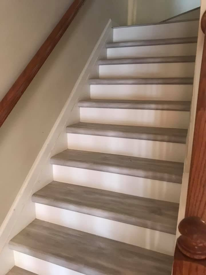 Wooden staircase with built-in LED lighting along the sides