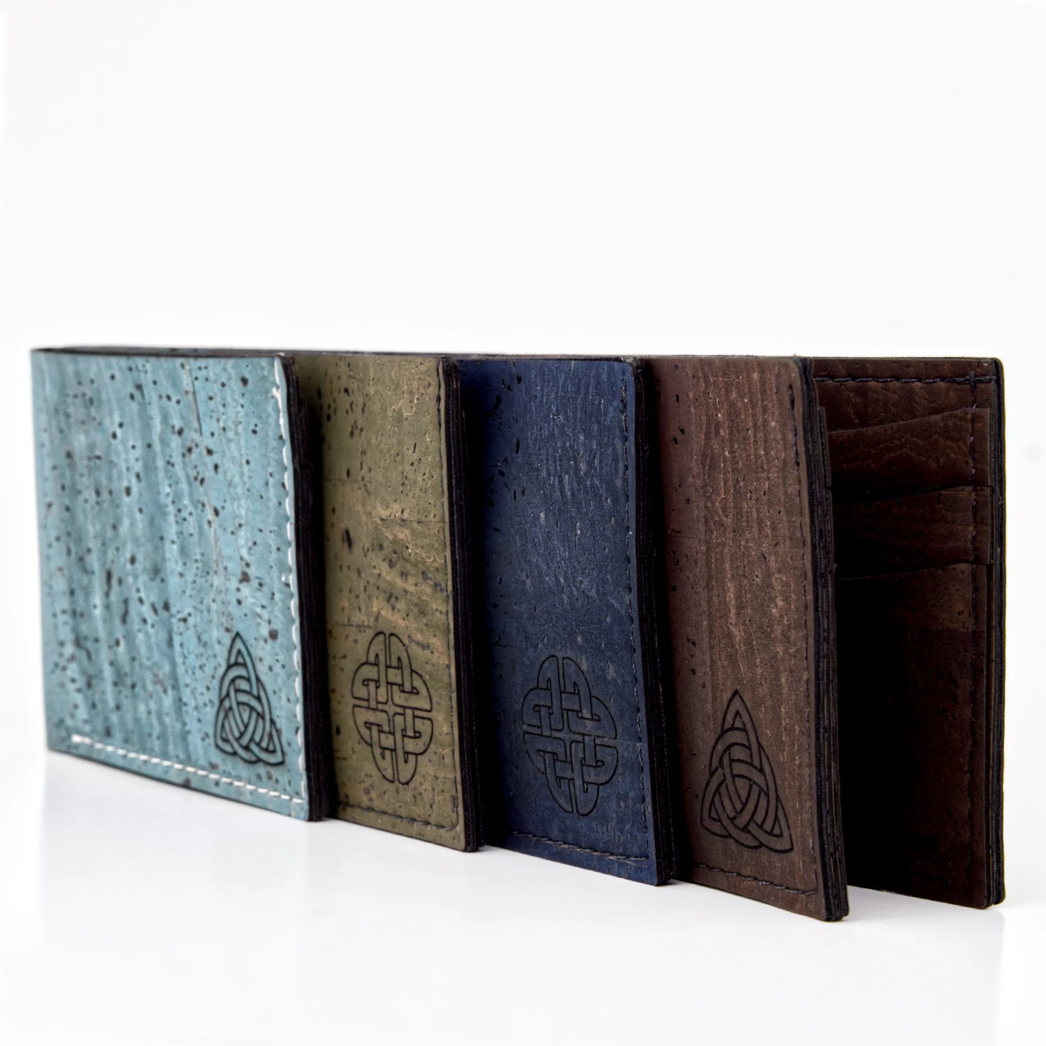 A set of five rectangular ceramic tiles placed vertically, each with different colors and intricate patterns.
