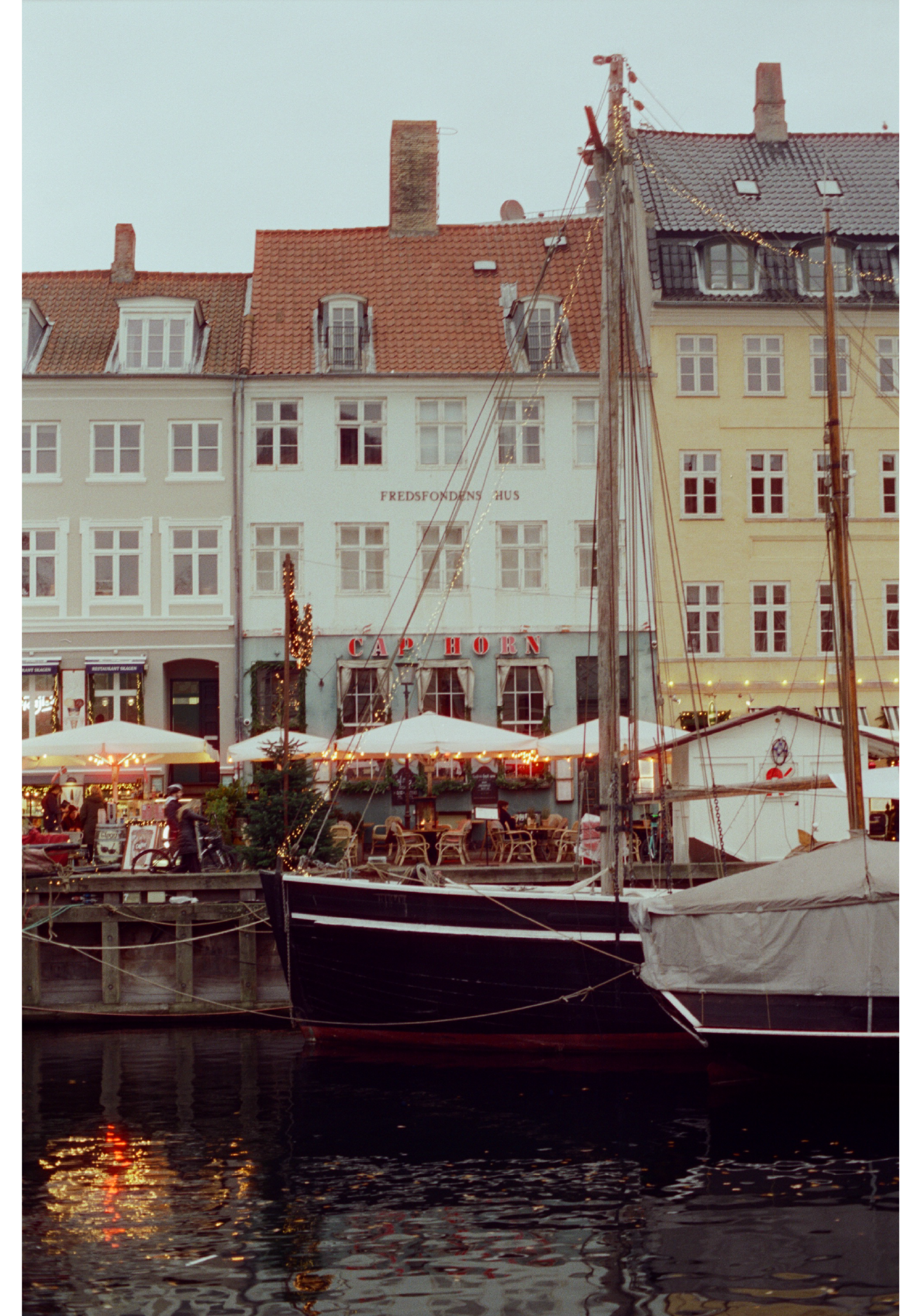 Nyhavn Harbor, Copenhagen, Denmark is photographed on 35 mm film.
