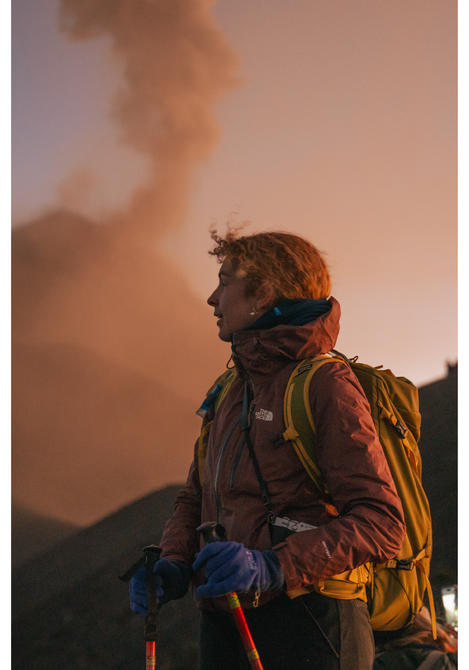 A woman embraces the majesty of an erupting volcano in Guatemala.