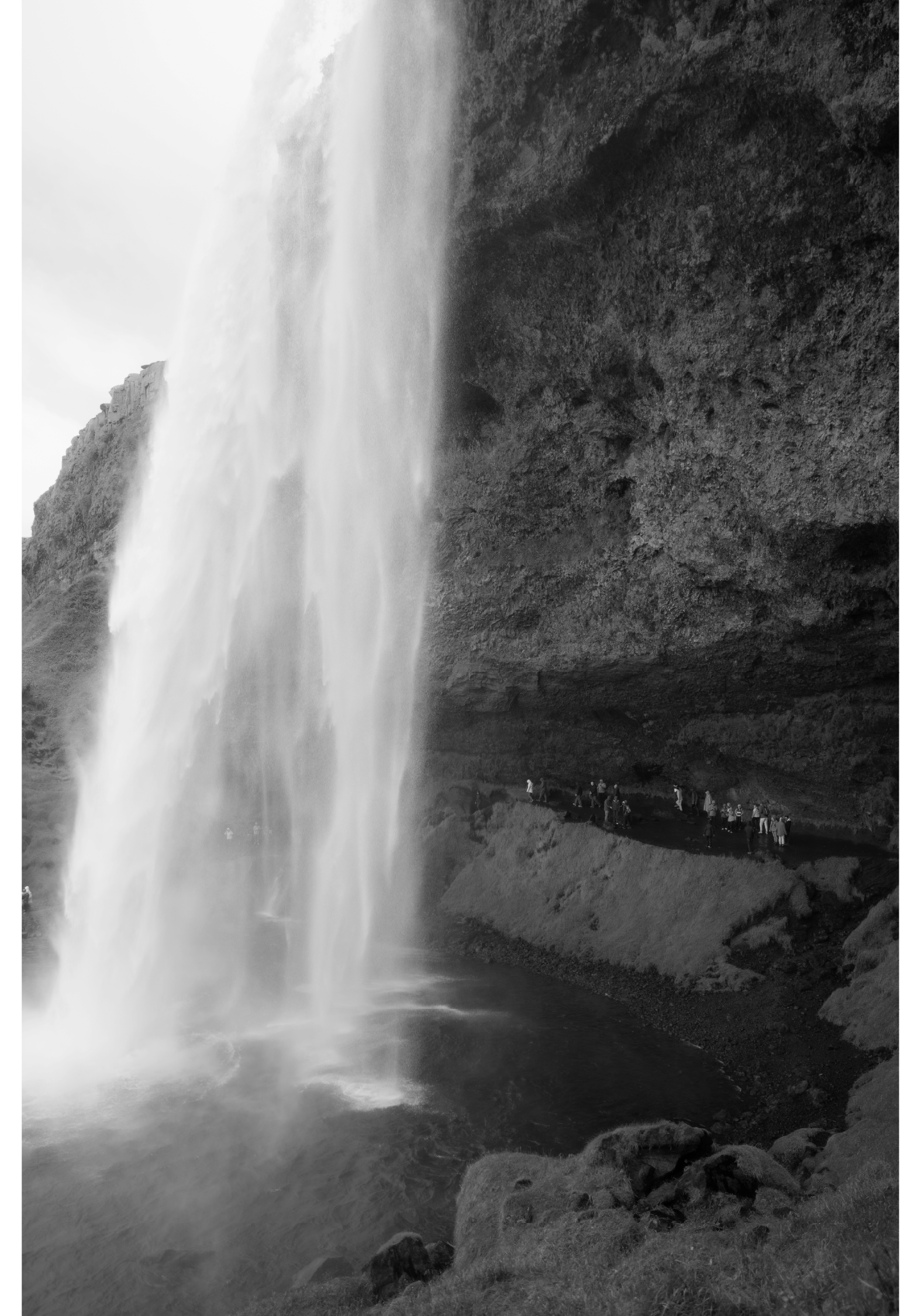 Black and white photography shows Seljalandsfoss in Iceland. 