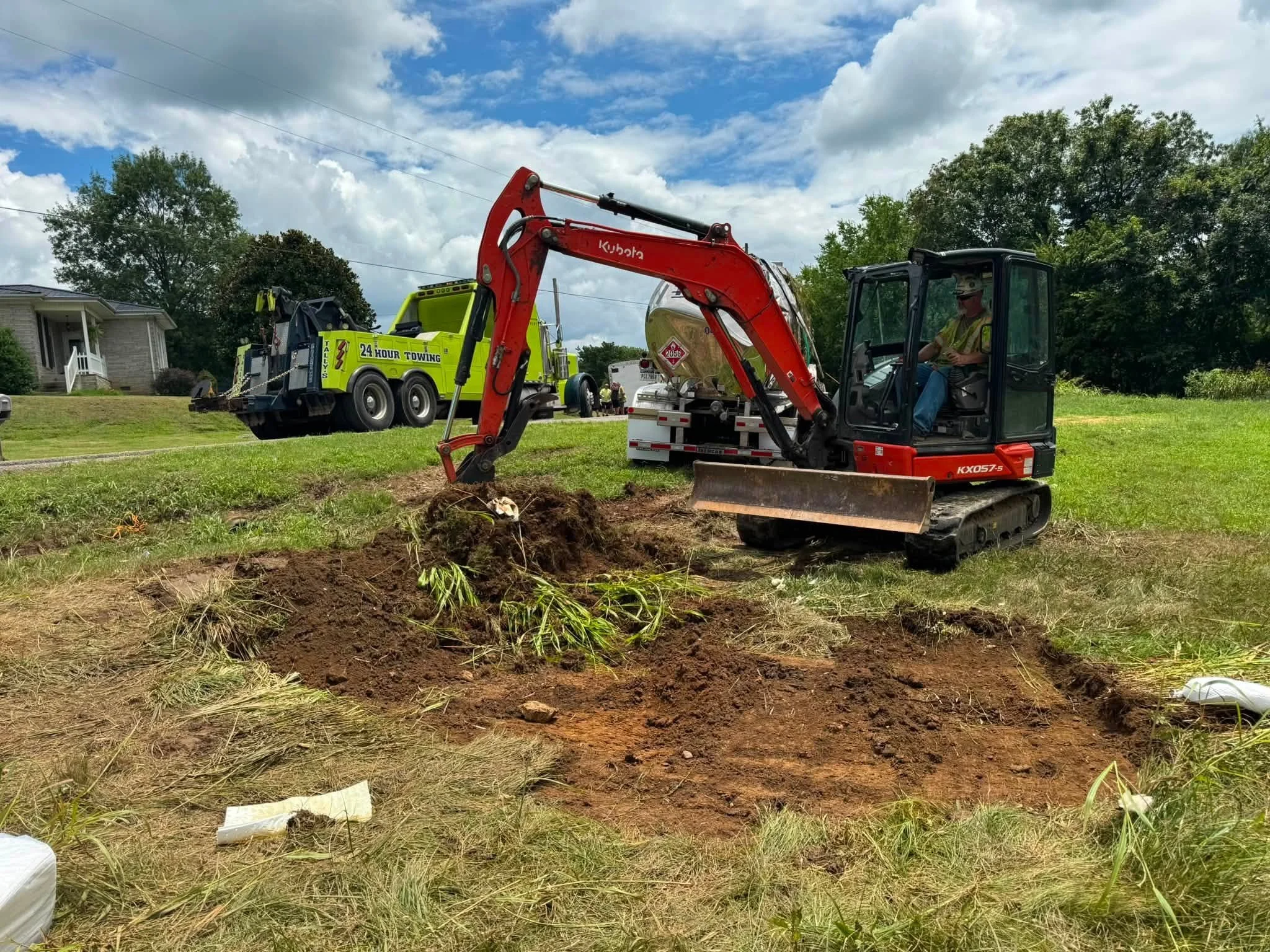 OES excavator performing environmental site remediation and soil work.