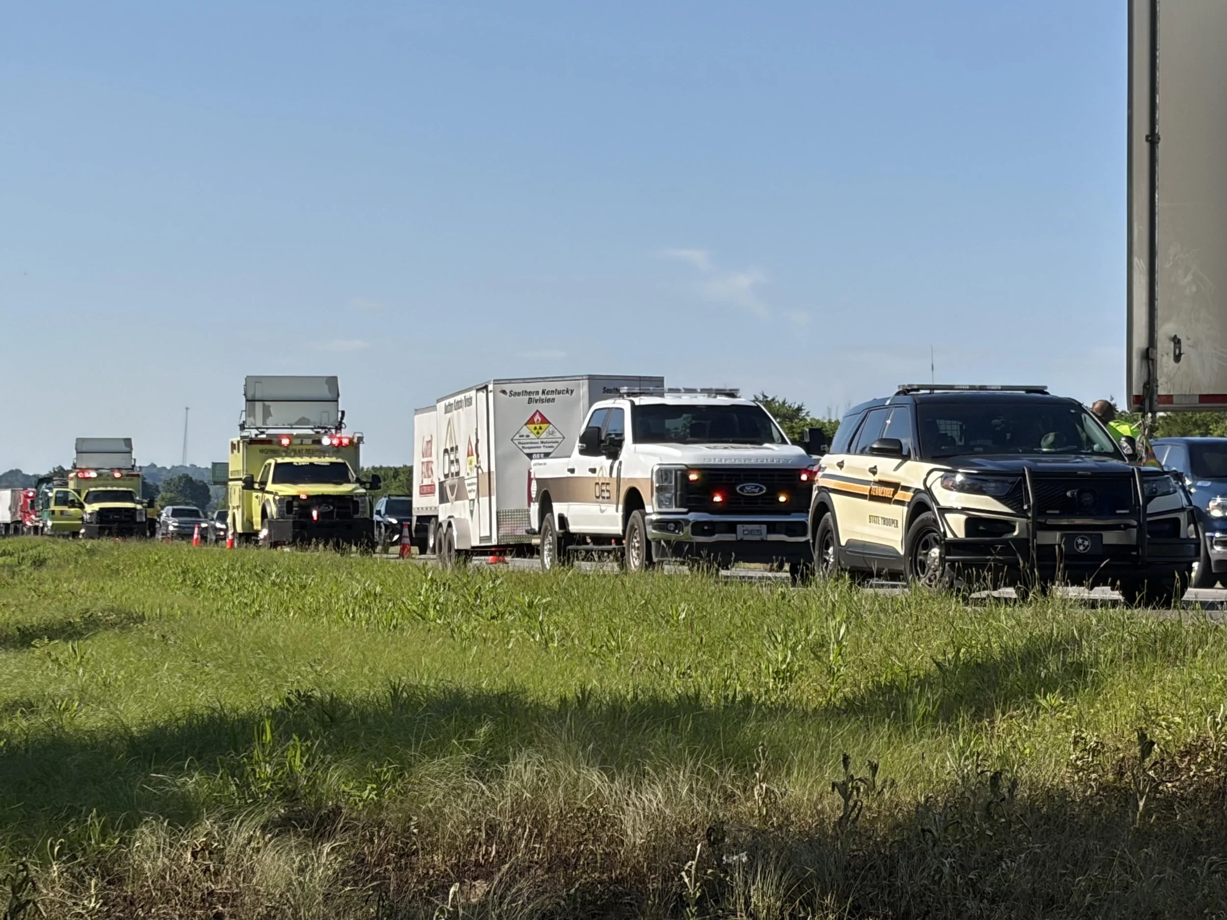 OES environmental response vehicles staged at a roadside emergency response scene.