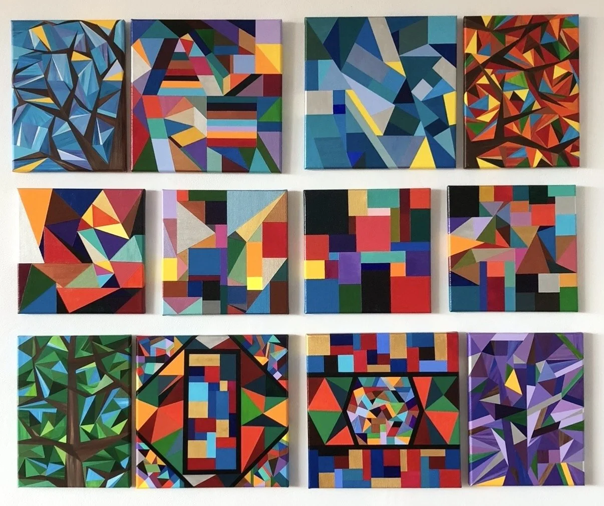 Twelve early original paintings by Marilyn Calleja, showing the evolution of her artistic style through colourful geometric shapes, layered triangles, trees and abstract compositions.