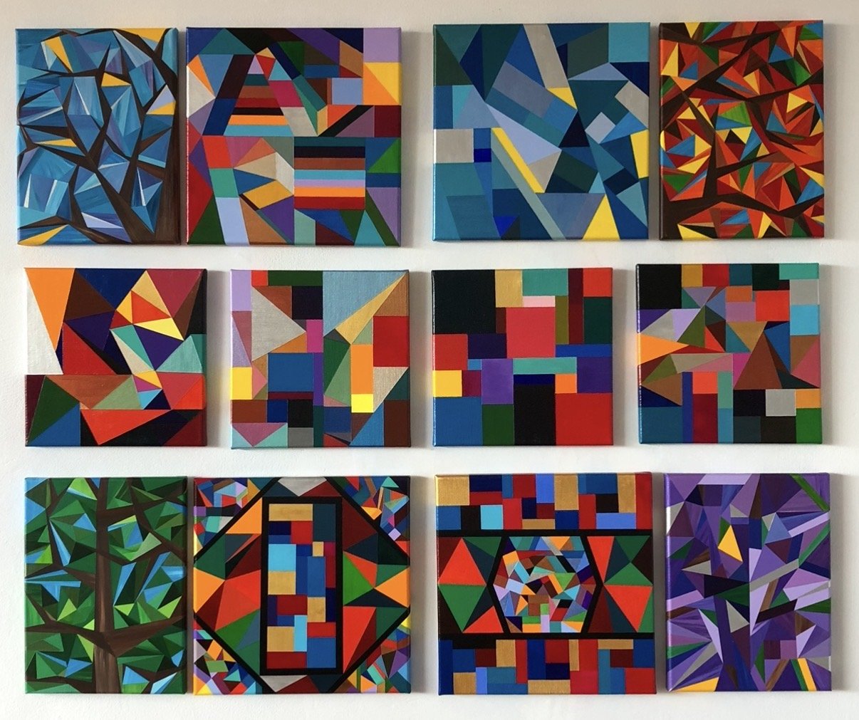 Twelve early original paintings by Marilyn Calleja, showing the evolution of her artistic style through colourful geometric shapes, layered triangles, trees and abstract compositions.