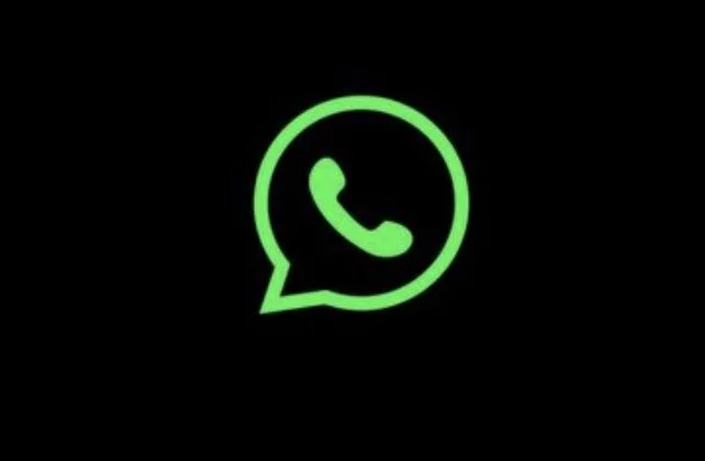 Green WhatsApp logo on black background.