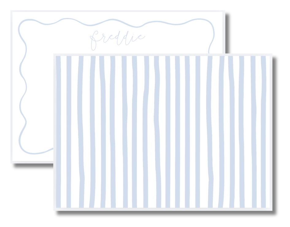 Two white cards with blue stripes and a scalloped border, with a handwritten name 'Freddie' on the top card.
