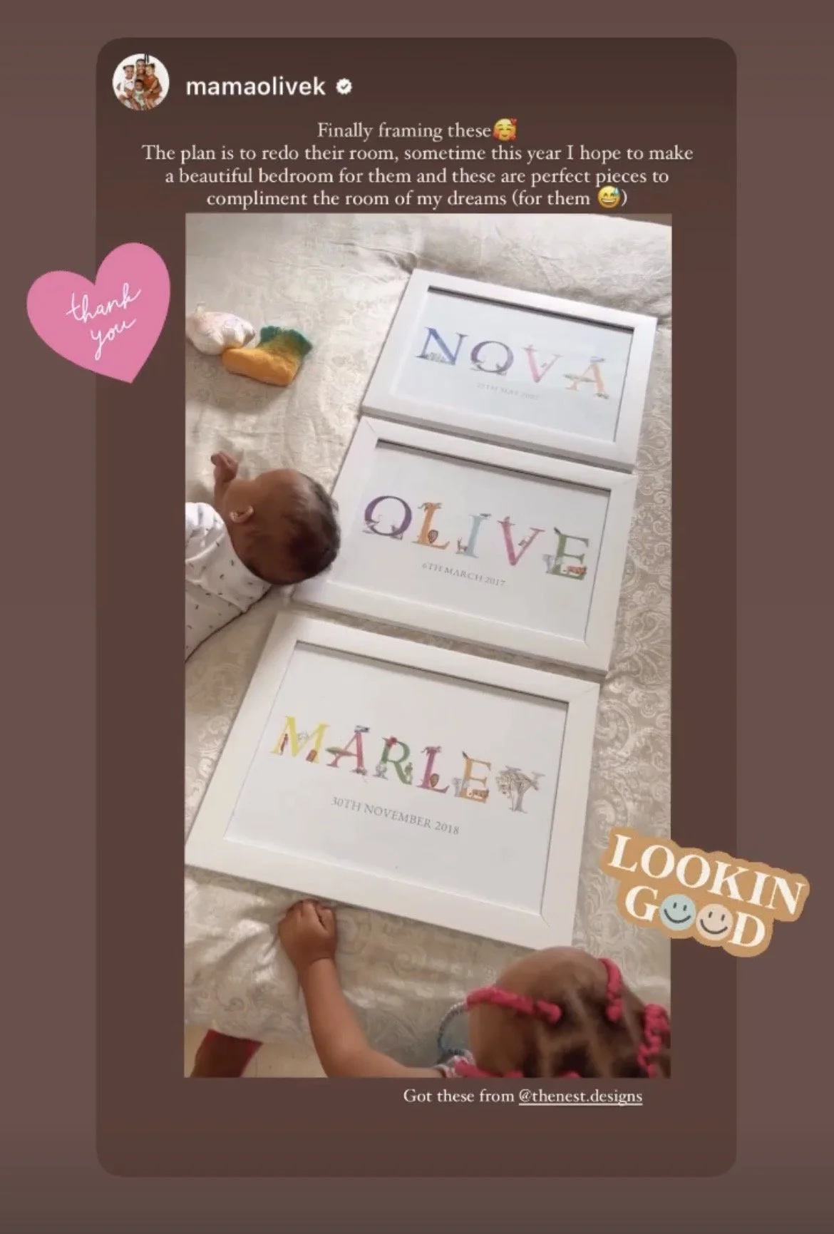 Three framed art prints with colorful text spell out 'NOVA,' 'LOVE,' and 'MÁRLEY,' arranged on a bed. Two children and a dog are seen in the image, with the children pointing at the frames.
