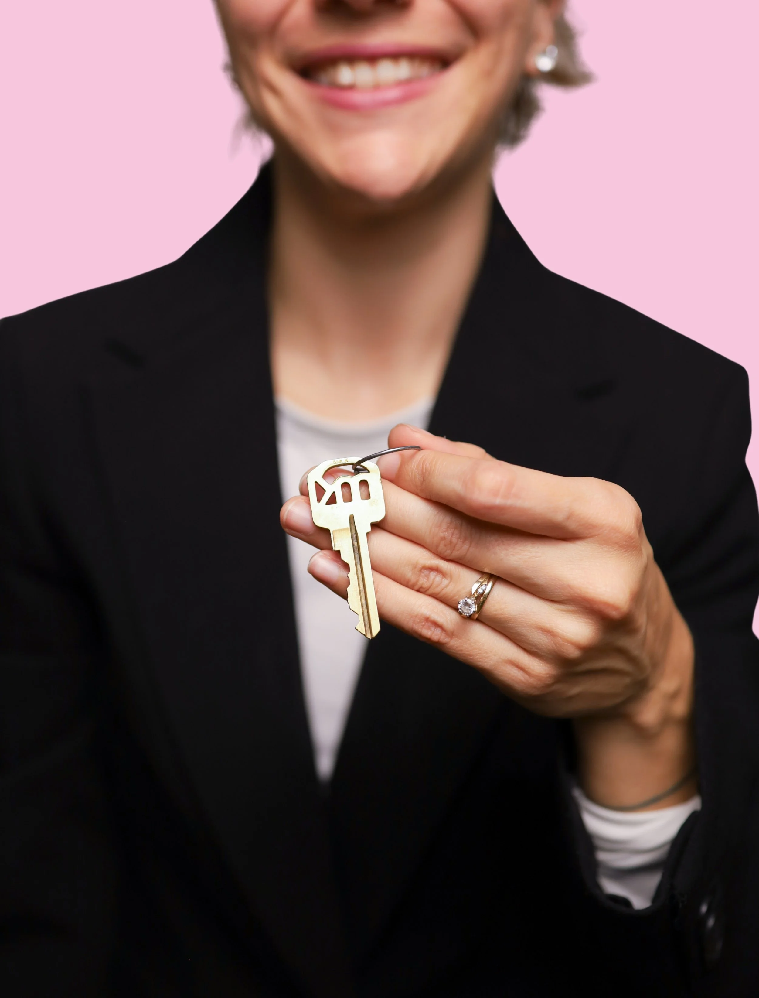 Long Island real estate agent Camila Retnauer holding house keys